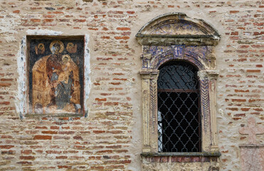  Velika Remeta Monastery,  Serbian Orthodox monastery on the mountain Fruska Gora, detail with a window and a fresco