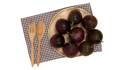 Passion fruit on wooden plate