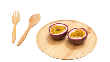 Passion fruit on wooden plate