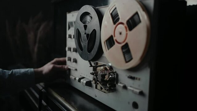 Wiretapping on the reel tape recorder in secret room. Special agent work. Spying conversations. Spy or intelligence gathering. Espionage concept.