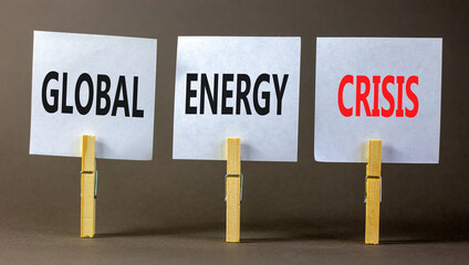 Global energy crisis symbol. Concept words Global energy crisis on white papers on wooden clothespins. Beautiful grey table grey background. Business and global energy crisis concept. Copy space.