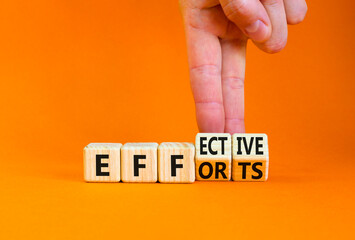 Effective efforts symbol. Concept words Effective efforts on wooden cubes. Businessman hand. Beautiful orange table orange background. Business effective efforts concept. Copy space.