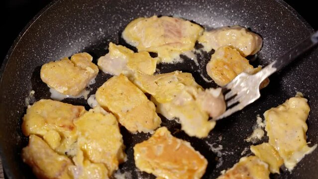 turn with a fork in a pan fry the pieces of white fish in the dough