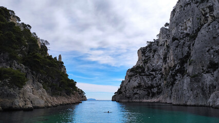 Fototapeta premium The Calanques National Park is a French national park located on the Mediterranean coast in Bouches-du-Rhône, Southern France. The beach of En-Vau and it's high limestone cliffs near Cassis.