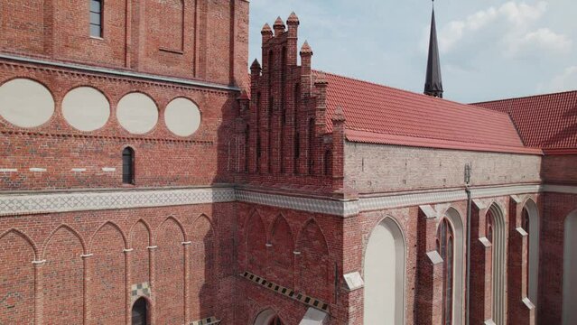 Drone flight around the ancient cathedral in the center of the old European town with tile roofs, Gdansk, Poland, 4k