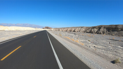 Drive through Death Valley National Park in California, USA. Desert road in Death Valley.