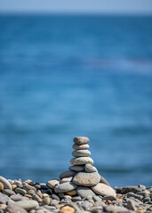 Stacked stones with the ocean. 