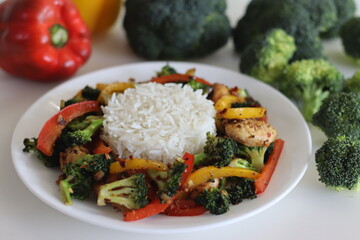 Stir fried vegetables with chicken. Air fried chicken tossed with sauteed bell peppers and...