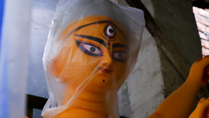 kolkata, kumartali,India, dated 09.09.2022. Idol of maa durga covered with plastic to protect from...