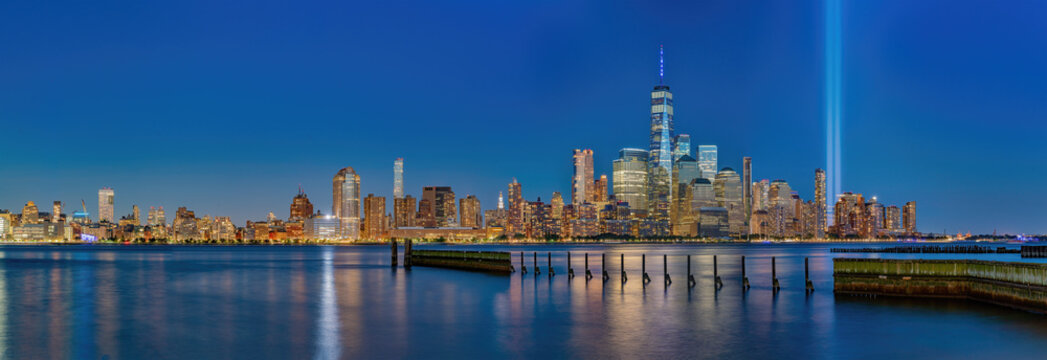 New York's World Trade Center Tower Looks Majestic Against A Floodlit Night Sky On September 11, 2021, The Anniversary Of The Terrorist Attack On The Twin Towers.