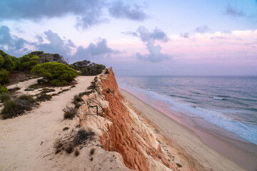 Coloured sunset over the beautiful landscape in Praia de Falesia , Algarve region, Portugal....