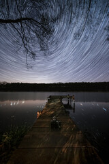 Starry night over bridge at the lake - 532520756