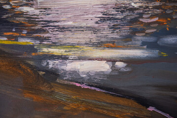 Close up detail of brushstrokes in acrylic and oil paint on an artist's palette.