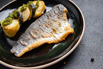sea ​​bass fried fish vegetables and seafood healthy meal food snack diet on the table copy space food background rustic top view keto or paleo diet veggie or vegetarian food pescatarian