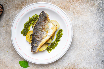 sea ​​bass fried fish vegetables and seafood healthy meal food snack diet on the table copy space food background rustic top view keto or paleo diet veggie or vegetarian food pescatarian