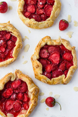 Mini-biscuits made of strawberries on a white background. Delicious mini-pies. Top view