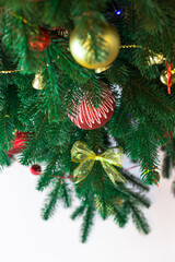 New Year's card. Christmas tree decorated with gold and red balls. Top view
