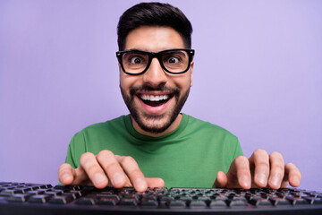 Photo of handsome geek nerd coder in spectacles green pullover writing code making new application...