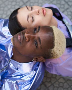 Futuristic portrait of a mixed race fashion couple