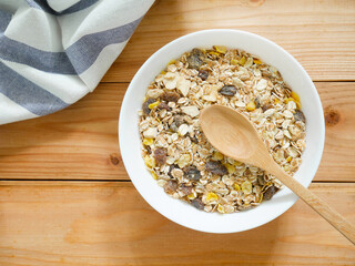 A Bowl of muesli breakfast and rolled oats with dried fruits