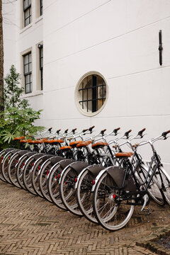 Vintage bicycles parked near building wall