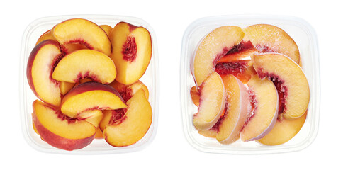 Plastic container with raw and frozen halves of peaches. Top view of fruits isolated on white...
