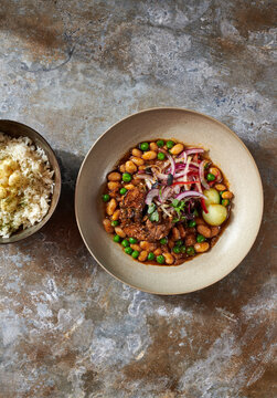 Braised Lamb Shank with Great Northern Beans and Garlic Rice