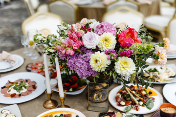 Setted table with food and flowers 