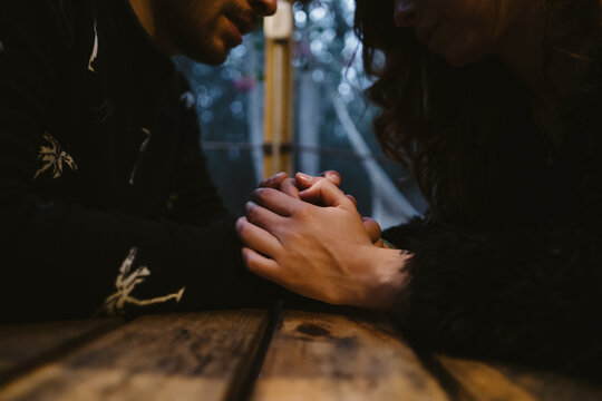 Close Up Of Young Couple Holding Hands