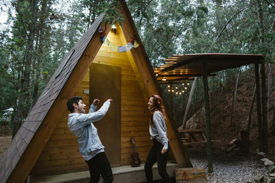 Stylish happy couple dancing Outdoors - Powered by Adobe