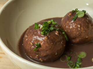 meatballs with Jamon serrano and cheese in sauce