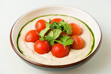 cream soup with tomatoes and greens