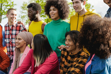 Young diverse group of people having fun outdoor - Diversity and multiracial friends concept