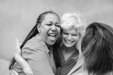 Happy diverse senior people having fun greeting each other outdoor - Older friends community...