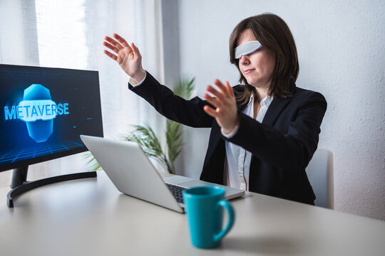 Business woman using futuristic augmented virtual reality glasses work inside metaverse technology - Focus on face