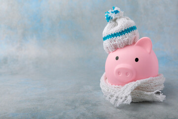 Savings concept. Piggy bank and money on a yellow textural background. A piggy bank in a warm...