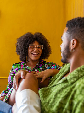 Black Couple Hanging out at home in vintage clothing 