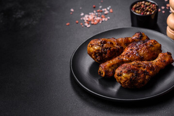 Delicious ruddy grilled chicken legs with spices and herbs