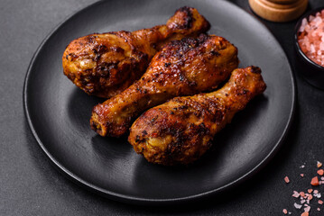 Delicious ruddy grilled chicken legs with spices and herbs