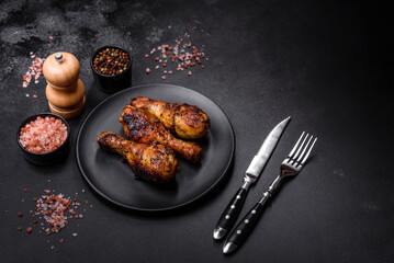 Delicious ruddy grilled chicken legs with spices and herbs