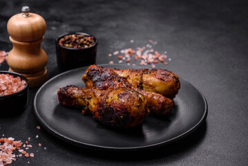 Delicious ruddy grilled chicken legs with spices and herbs