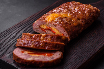 Delicious fresh ground beef meat roll with cheese, tomatoes and sweet peppers