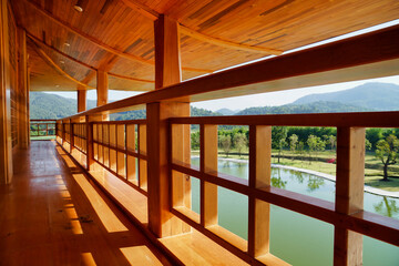 Horizontal photo of beautiful wooden building corridors japan style and natural scenery in the background.
