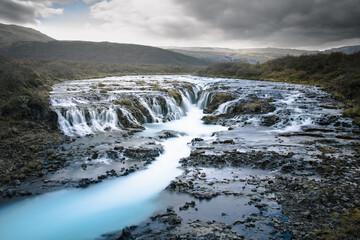 Bruarfoss view. Awesome waterfall in Iceland with blue water river.