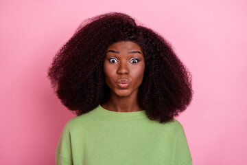 Photo of romantic big hairdo brunette lady blow kiss wear green sweatshirt isolated on pink color...