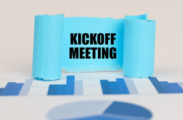 On the blue diagram and graphs there is a twisted paper plate with the inscription - Kickoff Meeting