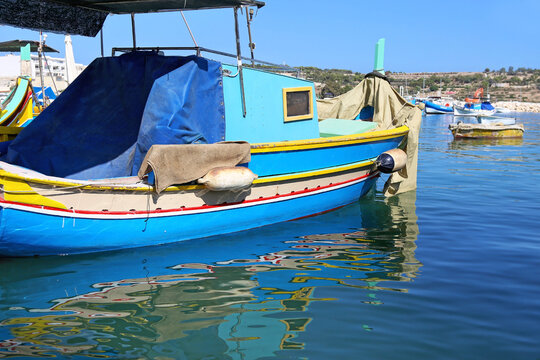 traditional blue fishing boat at Marsaxlokk village Malta