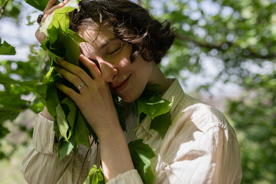 girl hugging a branch
