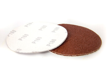 Round discs of sandpaper isolated on white.
