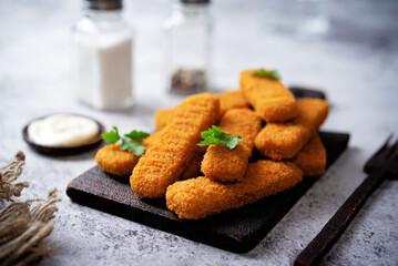 Fresh prepared fish sticks with sauce